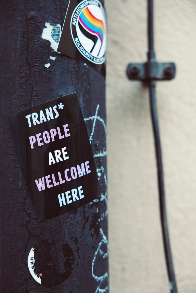 sticker on a post with the inscription: Trans* people are welcome here 